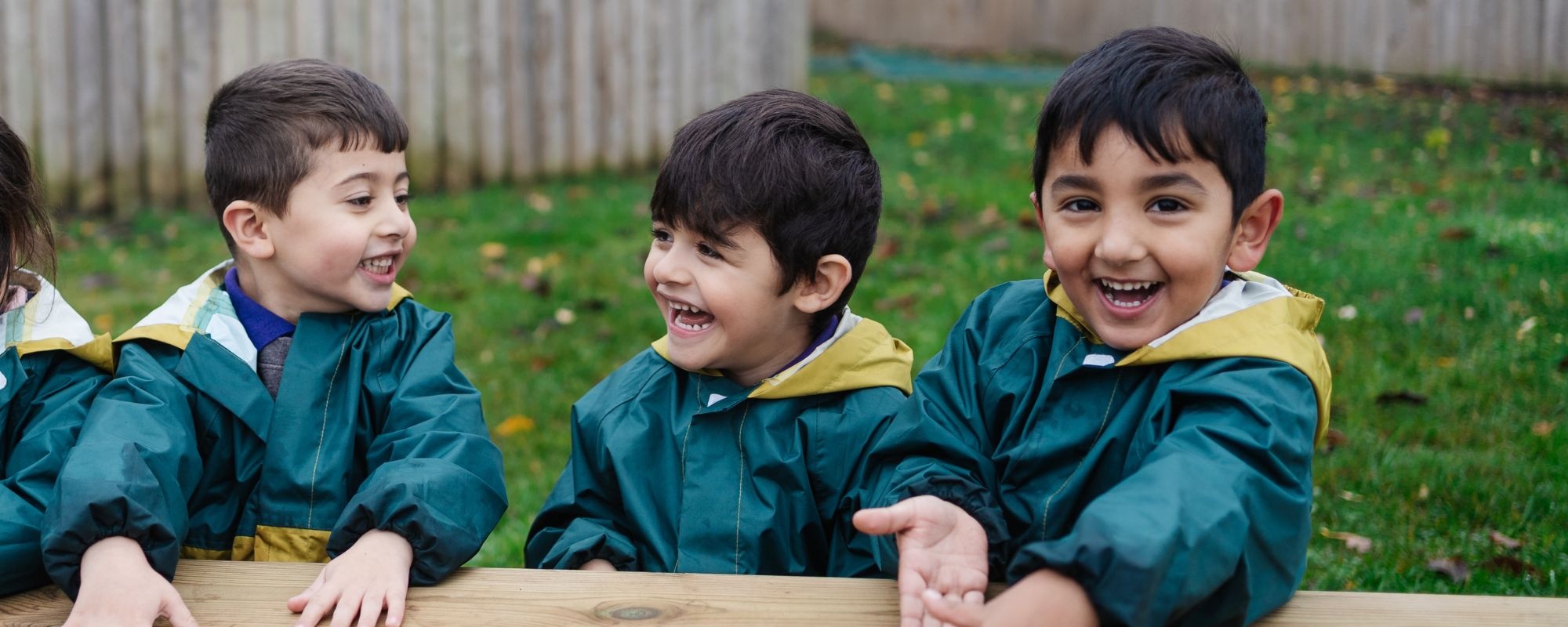 Header image showing children on tricycles